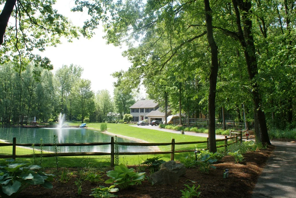 View of pond with the house and driveway.JPG