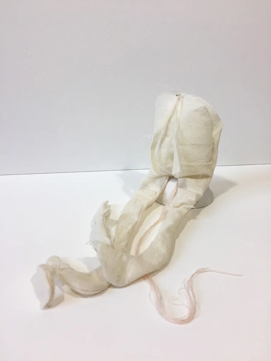 Muslin, thread, pin, clay pedestal 9" x 4" x 3" 2017