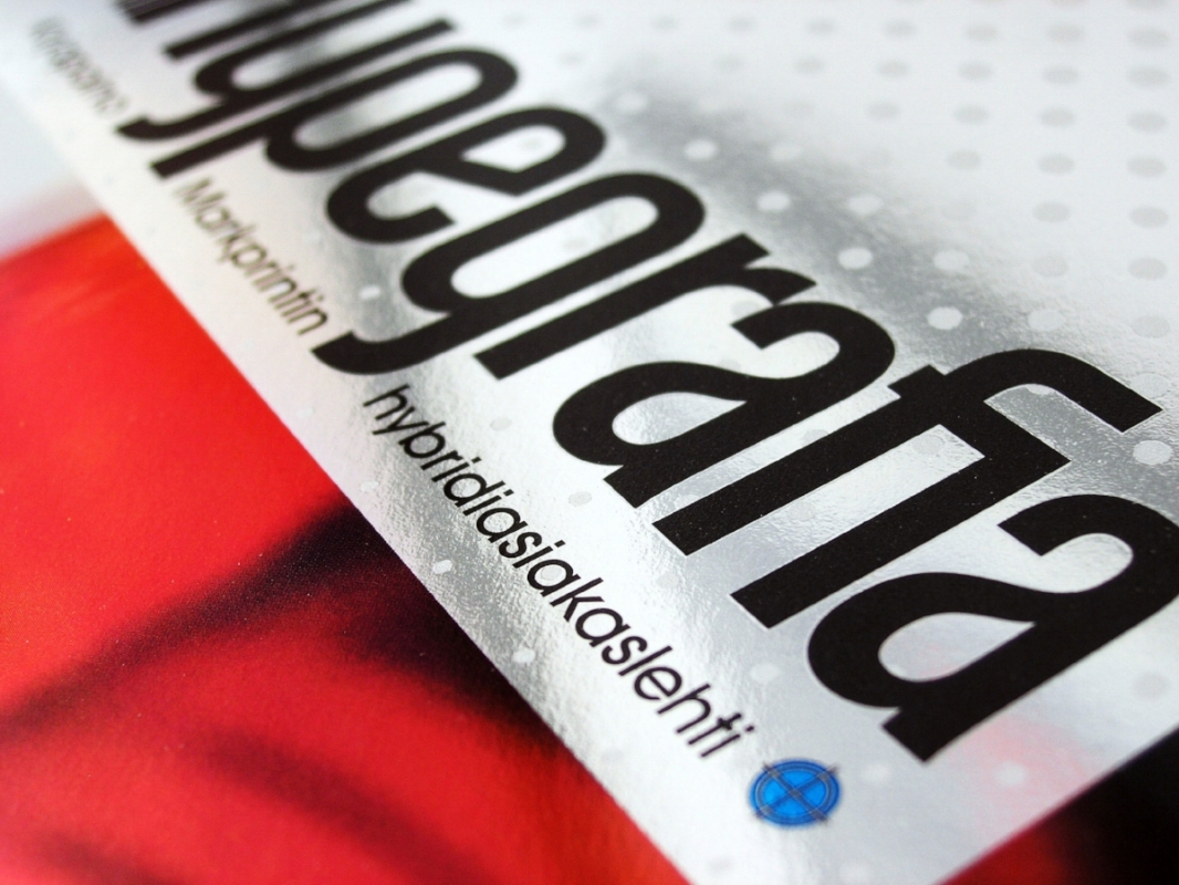 A detail from the cover of Hypegrafia magazine's issue No. 1, printed in 4-color with drip-off varnish on a silver foil