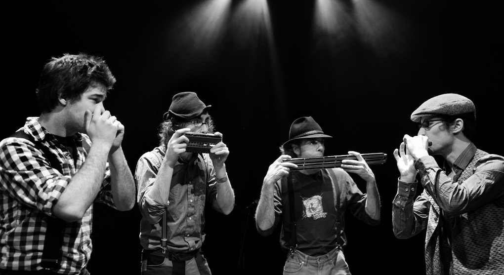 D’Harmo is strictly composed of harmonica players. This type of band rarely seen and heard truly offers a one-of-a-kind show. D’Harmo performs an original roster of songs composed by its members and played using various types of harmonicas. The harmonicists : Pascal “Per” Veillette , Samuël Caron , Cédric Houdayer and Lévy Bourbonnais are among the most talented in Canada. Their music inspired from Klezmer, Quebec folklore, jazz and classical music combines modernity and tradition, eclecticism and pop. "Four harmonica players harmonize and improvise brilliantly across Jewish traditions, jazz, rag, minimalist music, minuet, waltz, tango, reel and beyond. But this foursome always expands on the original form of the genres it leverages. Then there is blowing, breathing, the exchange of roles and the instruments . . . The music swings and wails, ultimately influenced by dance tunes of the 2010s for big finishers. The combination is lush." www.dharmo.ca