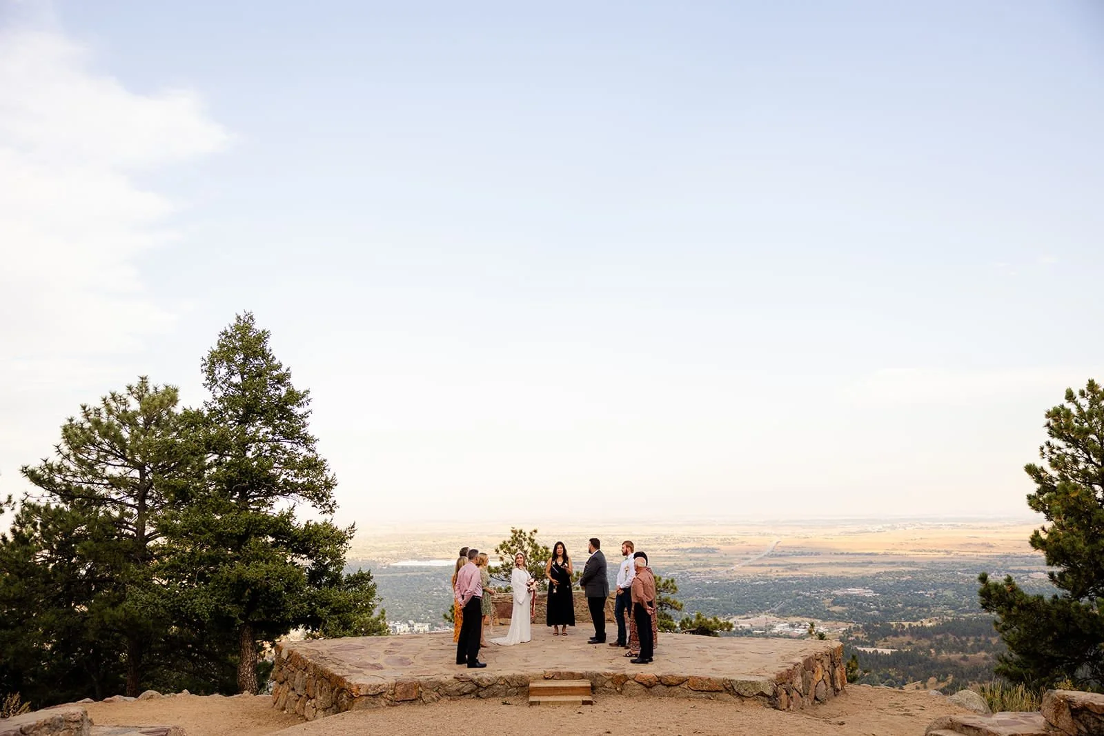 A Sunrise Amphitheater ceremony with the couple and their guests in a semi circle on the stone stage.