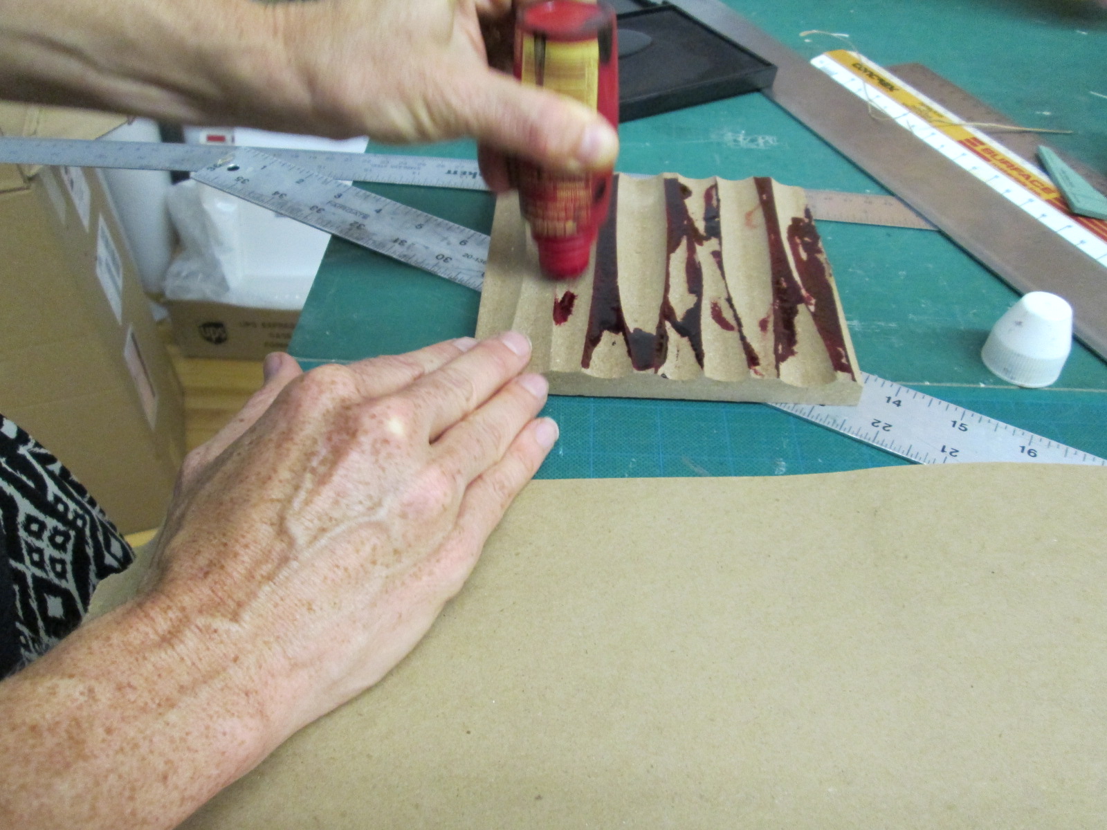 Kelly uses a wall material finish sample from our sample library...