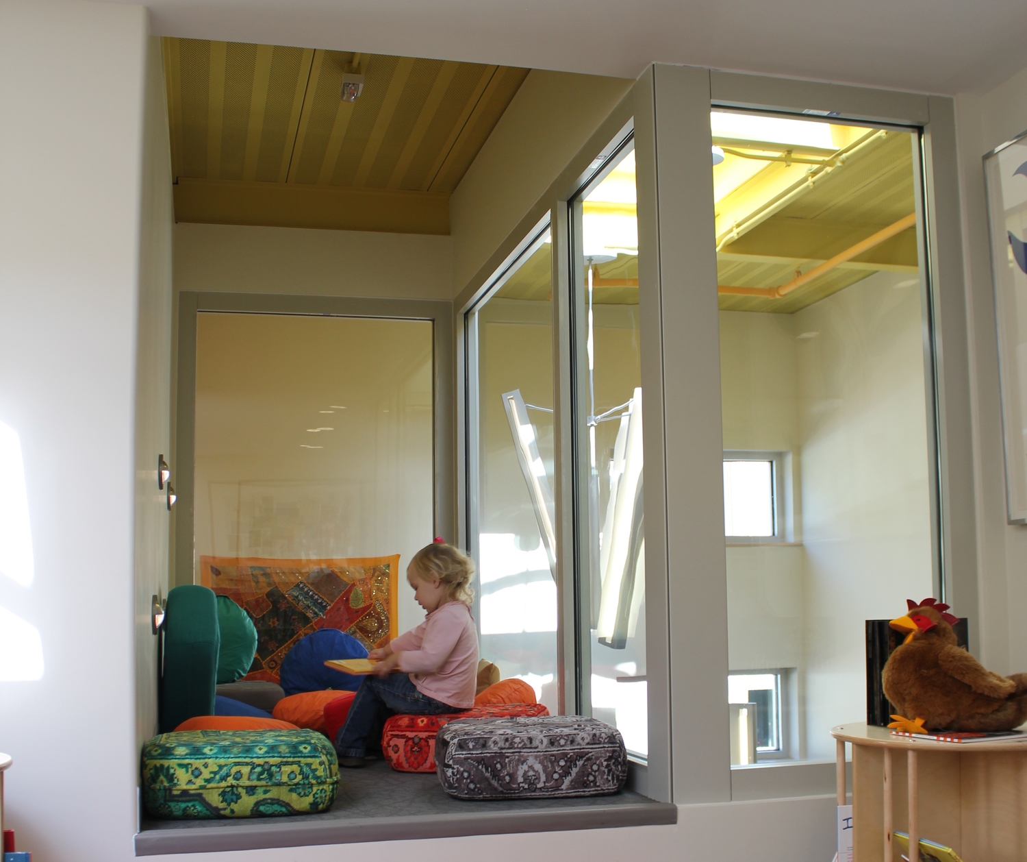 Typically underutilized, spaces like this one in a stair well was designed to include a destination reading nook for the MIT Child Care Center. 