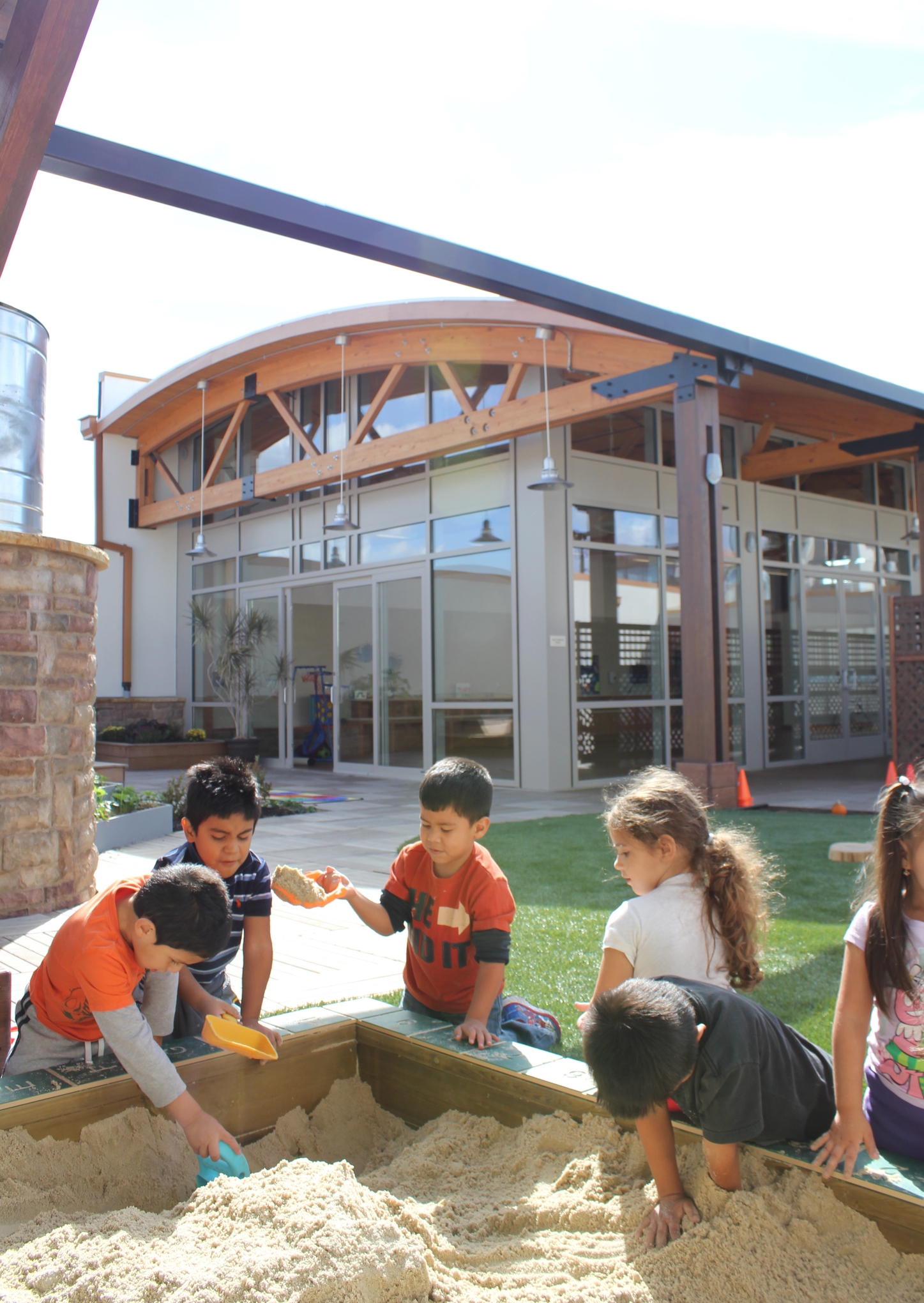 Preschoolers enjoying the sandbox on the rooftop playground, Photo by Sean Gray 