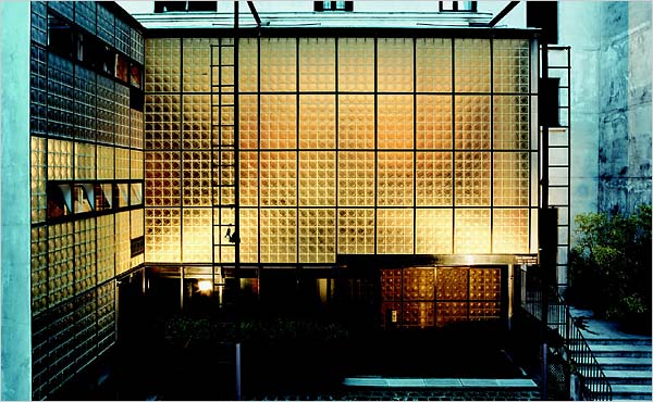 The iconic image of Maison de Verre's glass block facade lit from within. Image: "La Maison de Verre," published by Thames & Hudson