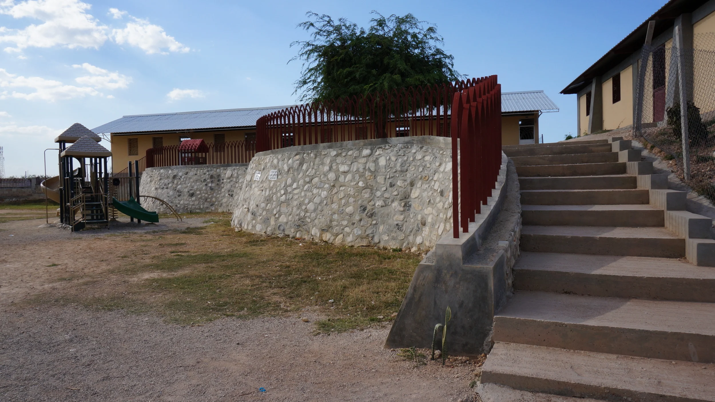  Center quad of school campus with retaining wall separating the kindergarten play area.&nbsp;&nbsp; 