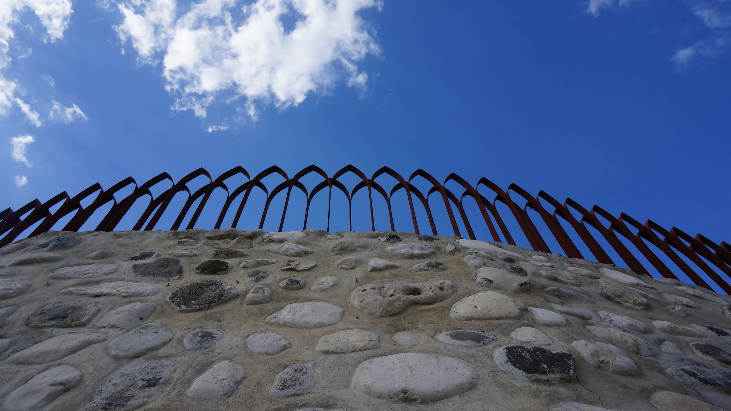  Local rock retaining wall with railing for kindergarten play area. &nbsp;Engineered with Build Change to provide simple construction method with local rock.&nbsp; 
