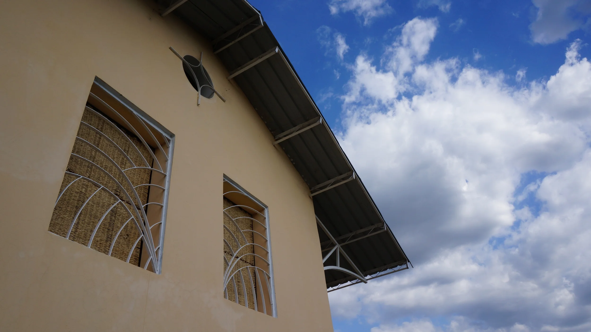  Local metal welder designed windows &amp; woven latanye shutters, woven by Mom's who have kids that go to the school. &nbsp;The window security screens are designed by locals with unique coverings for every classroom.&nbsp; 