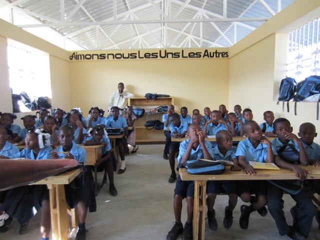 The problem of 'restaveks' is profound in this region. Kids become poverty orphans by being given to other families who then treat them as slaves. The idea for this school was started by Respire Haiti and currently educates over 500 kids, with most of them being restaveks. This classroom provides a great amount of openings for air and light to come into the space as their is no power in the area. 