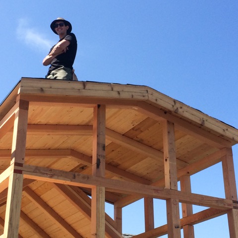  Raphael standing atop his house during the Tiny Home course. 