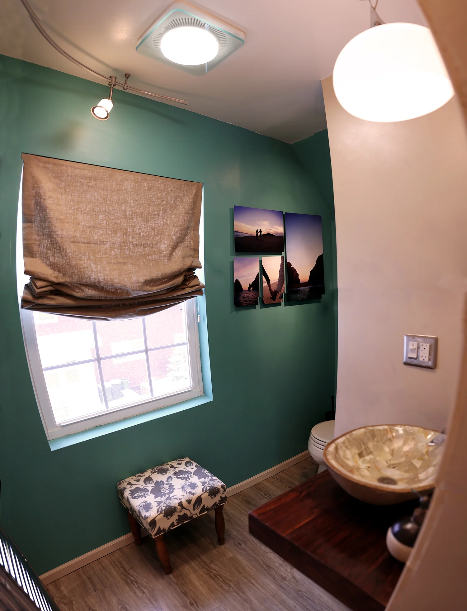 After - We opened up the room by tearing the wall down that had the closet and relocated the toilet and sink opening up the room a lot more.