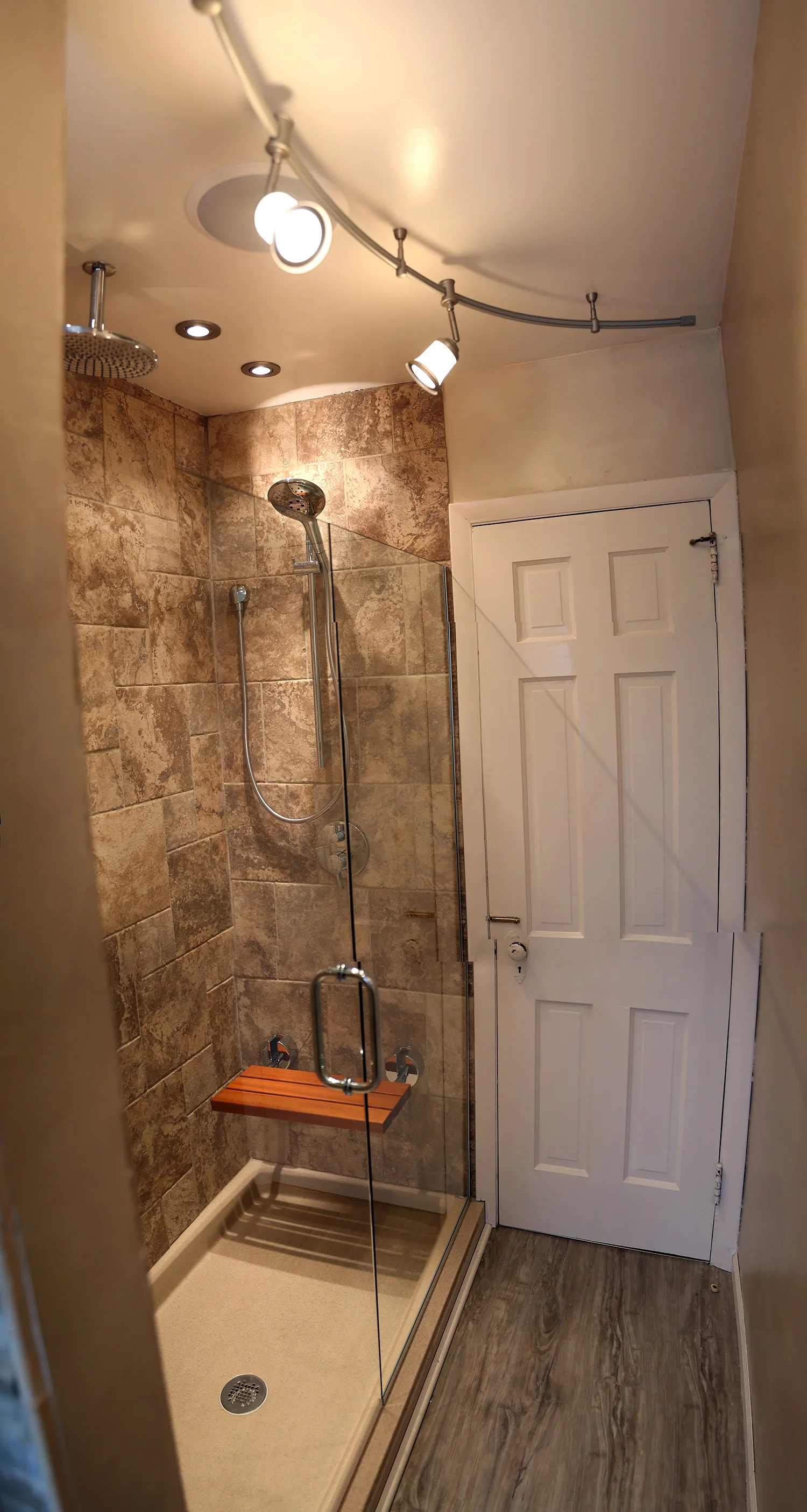 The fold down seat was also from Hudson Reed which is great to fold up when not in use. We used Hansgrohe Shower heads, and Michael had to have the rain head.