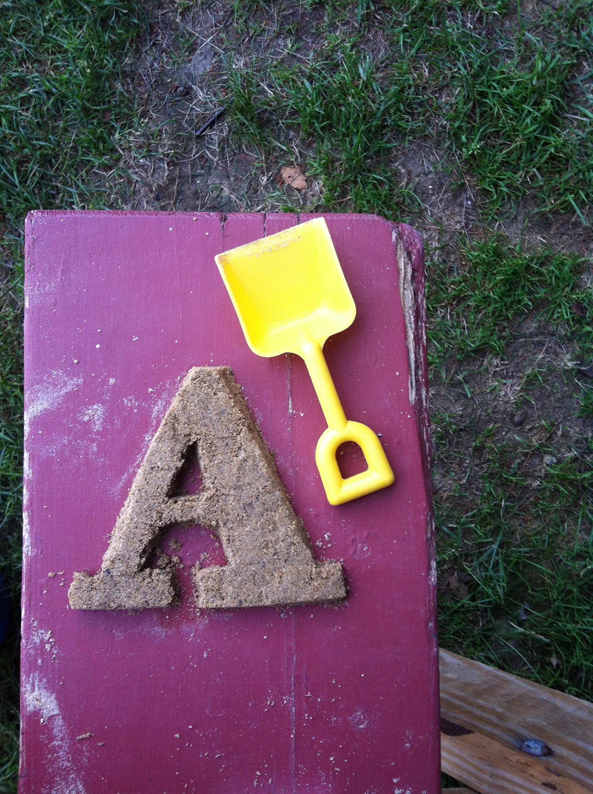     July 7:   A is for Abakee. Sand art at the picnic table.  