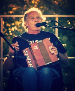 Louis Léger Louis plays accordion, fiddle, and sings.