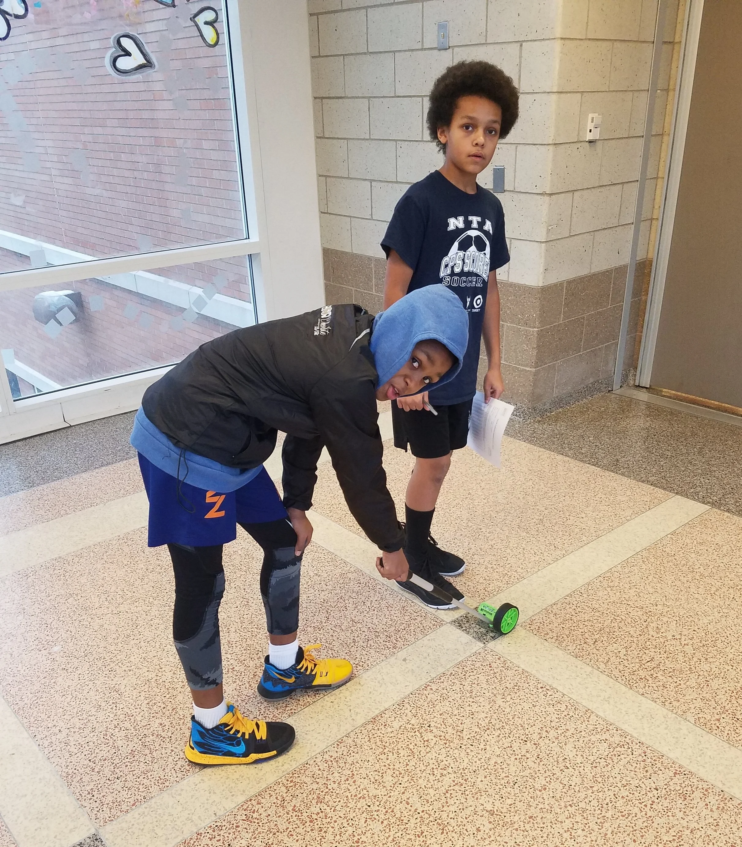 Students at NTA helping their Coach setup for the PACER test.