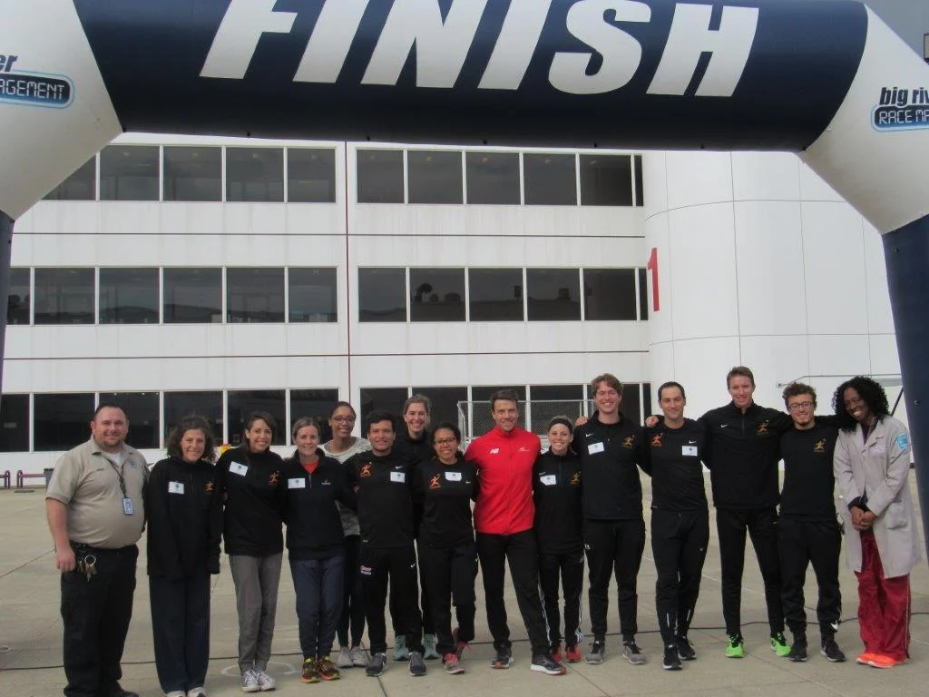 Chicago Run team, Dr. Ezike and JTDC staff, and me peeking out from behind after a successful race day.