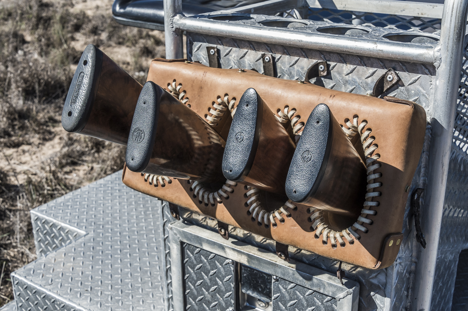 L:eather gun scabbards assure that all hunters can safely carry their finest shotguns.