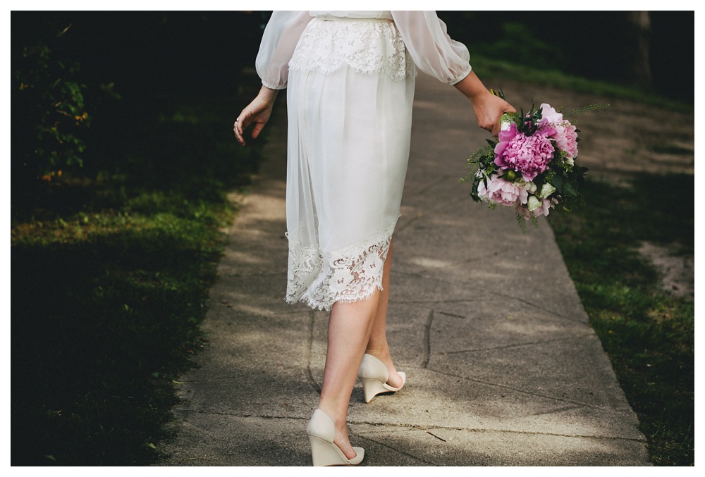 Bride walking in High Park with Crown Flora bouquet in Toronto.