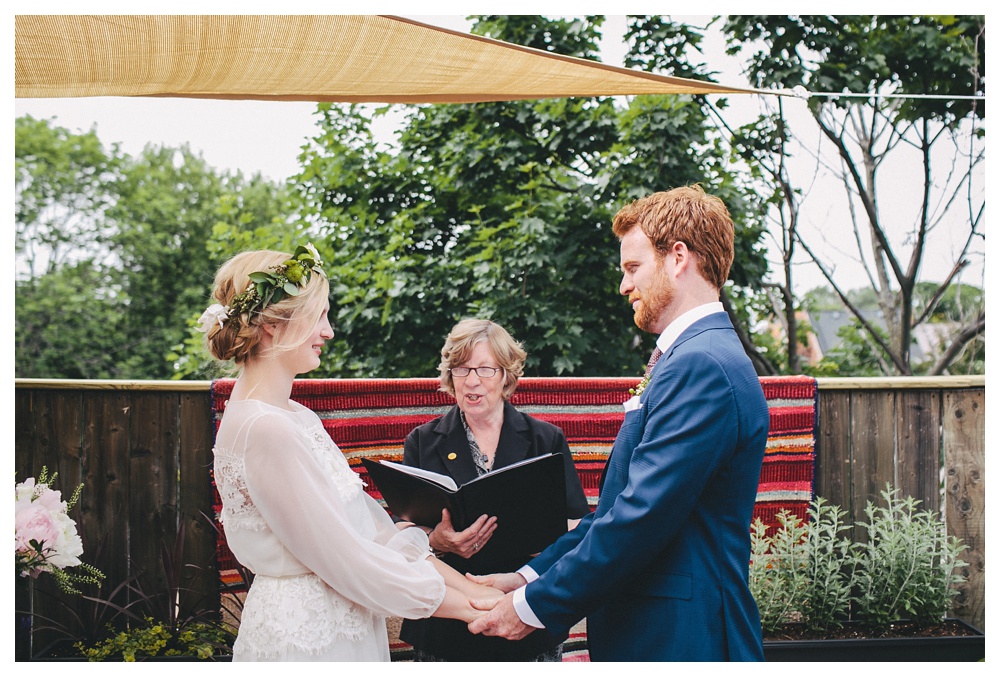 Intimate wedding ceremony on home balcony in Toronto. 