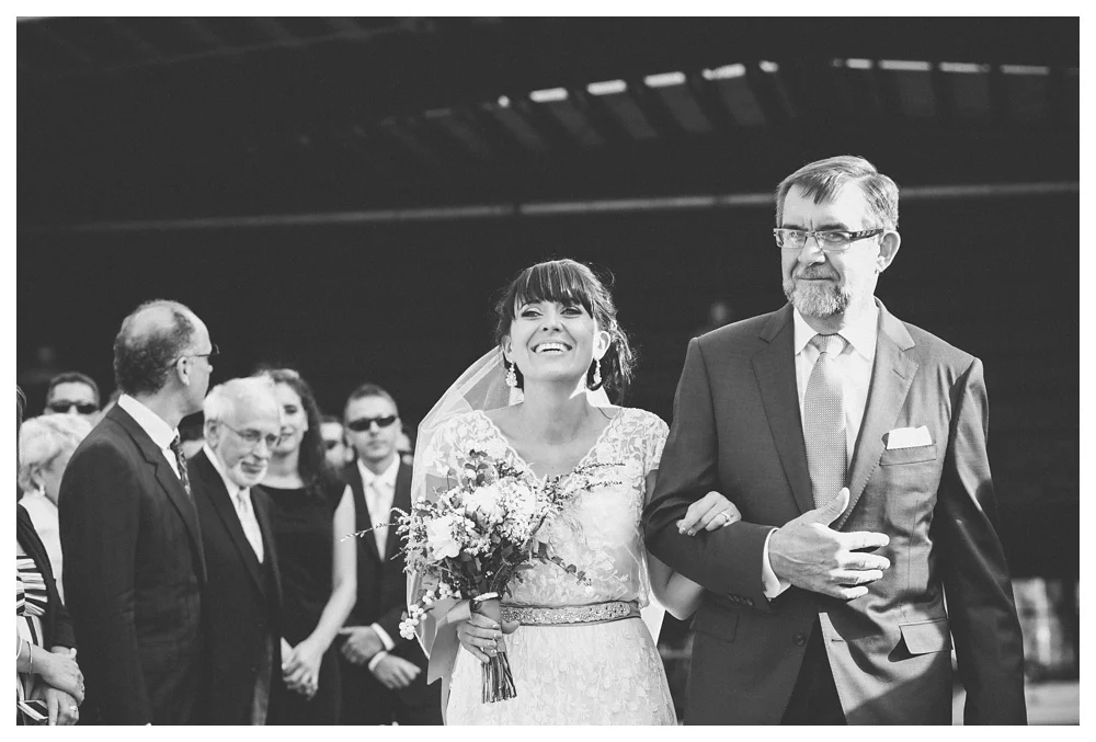 Bride walking down the aisle during wedding ceremony at Brickworks, Toronto.