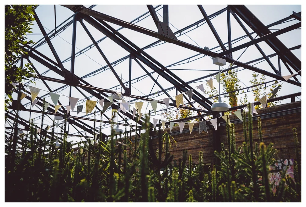 Colourful bunting flags decorating the cocktail area at Brickworks, Toronto.