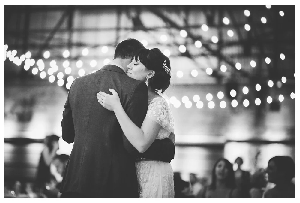 First dance under the string lights at a wedding at Brickworks.