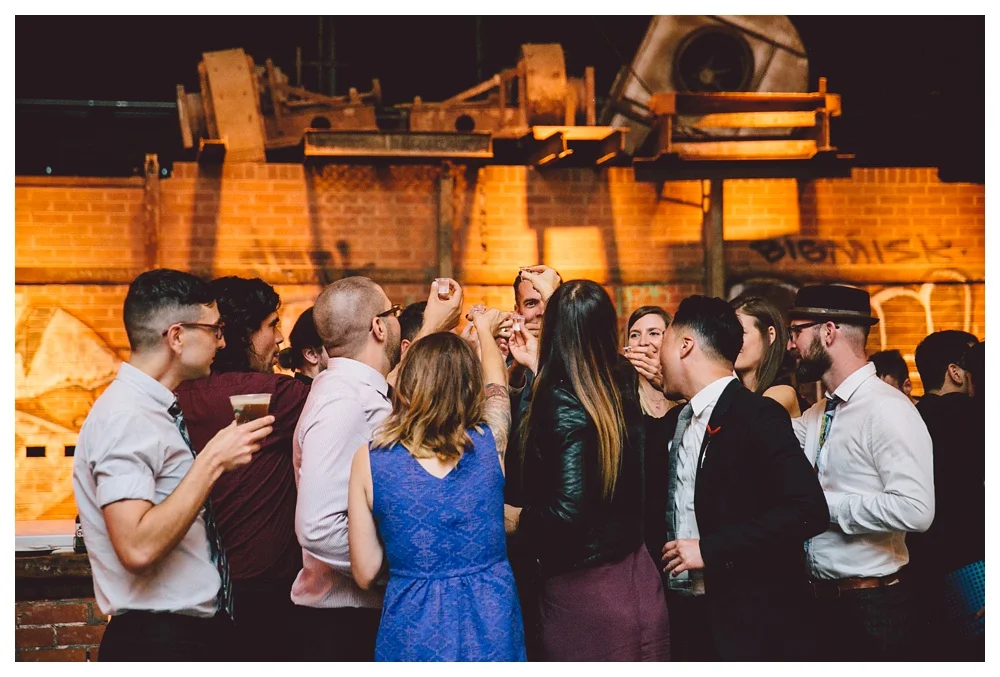 Raising a glass at a Brickworks wedding.
