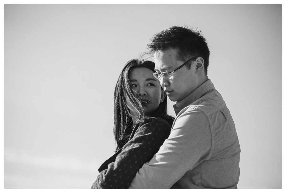 With the wind in her hair from the cliffs of Scarborough Bluffs, the bride embraces her husband to be. 