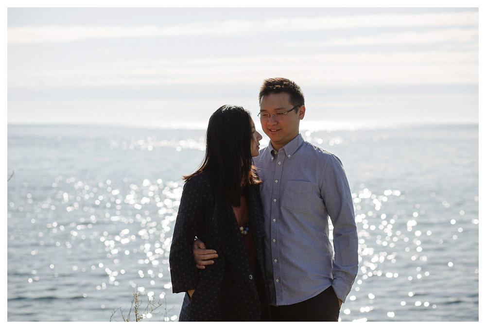 The twinkle of the sun on lake Ontario mirrors the twinkle of the love in the groom's eyes. 