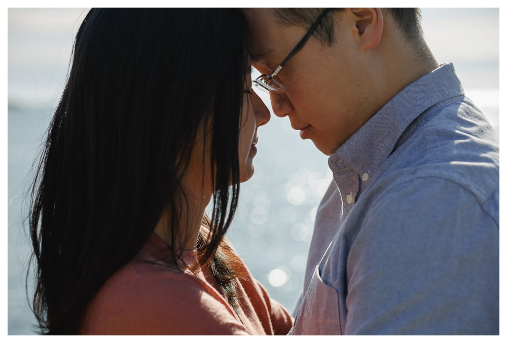 With their eyes closed, the bride and groom share love on their engagement photo day. 