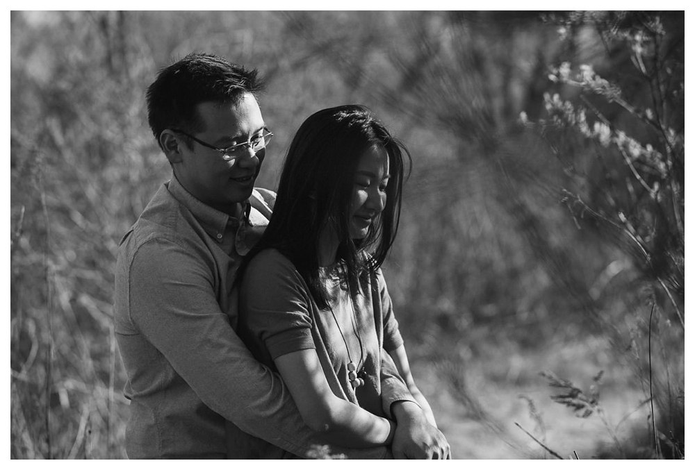 A loving engagement embrace caught in the memory of black and white. 