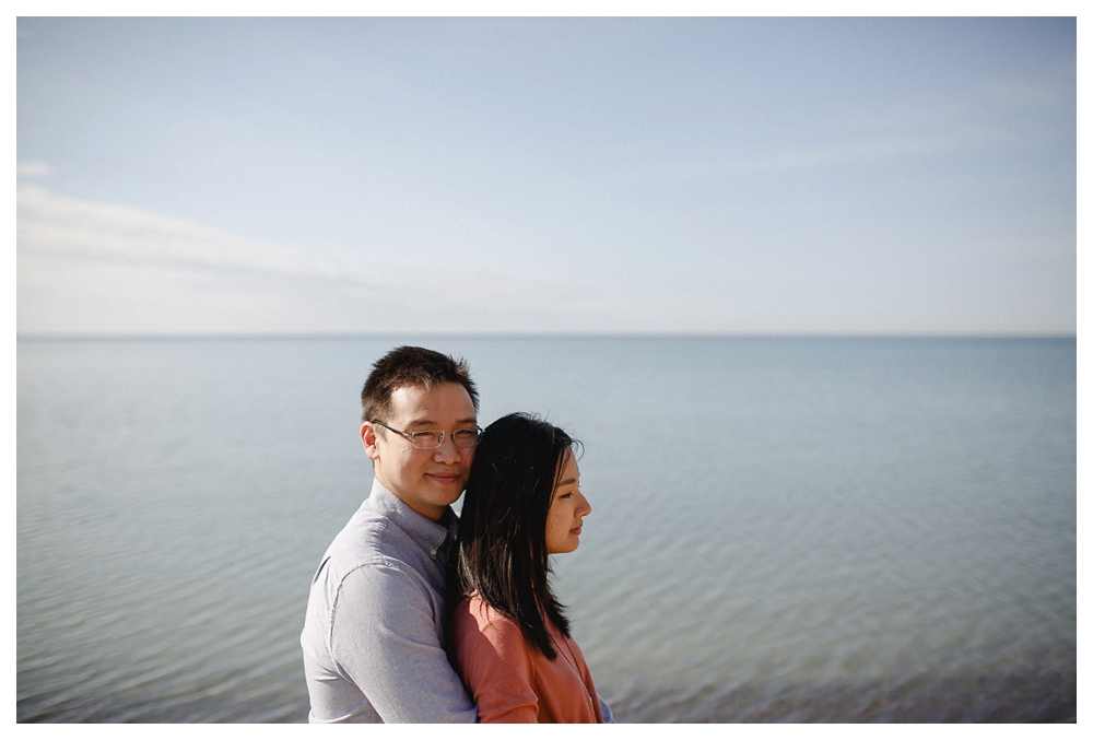 With the sunny lake Ontario in the back, the bride and groom shine. 