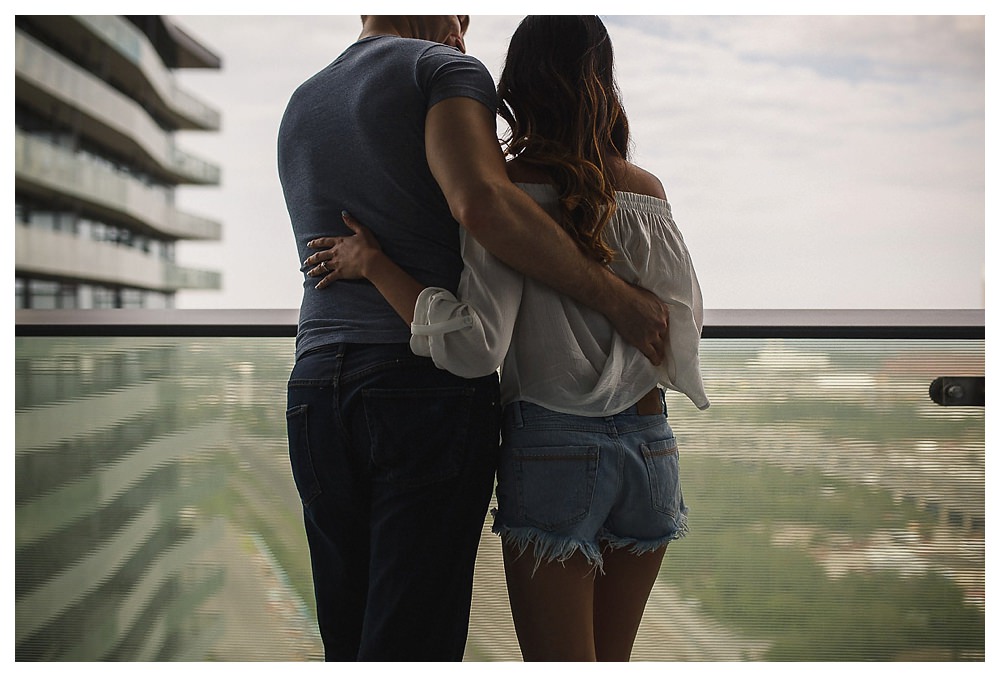 United together in an embrace with the city below them, the bride and groom started their engagement photo shoot. 