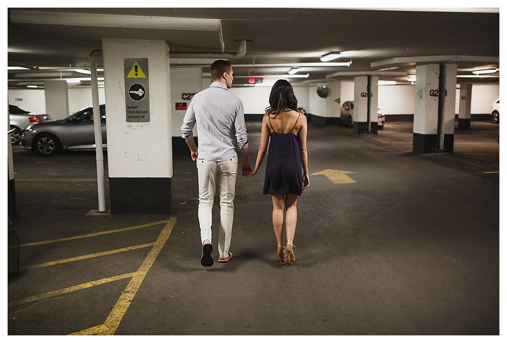 Downtown Toronto in the underground parking garage, the bride and groom begin their journey of their engagement photos. 