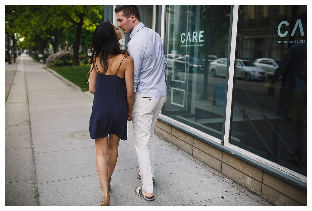 The loving care of bride and groom on the streets of Toronto. 