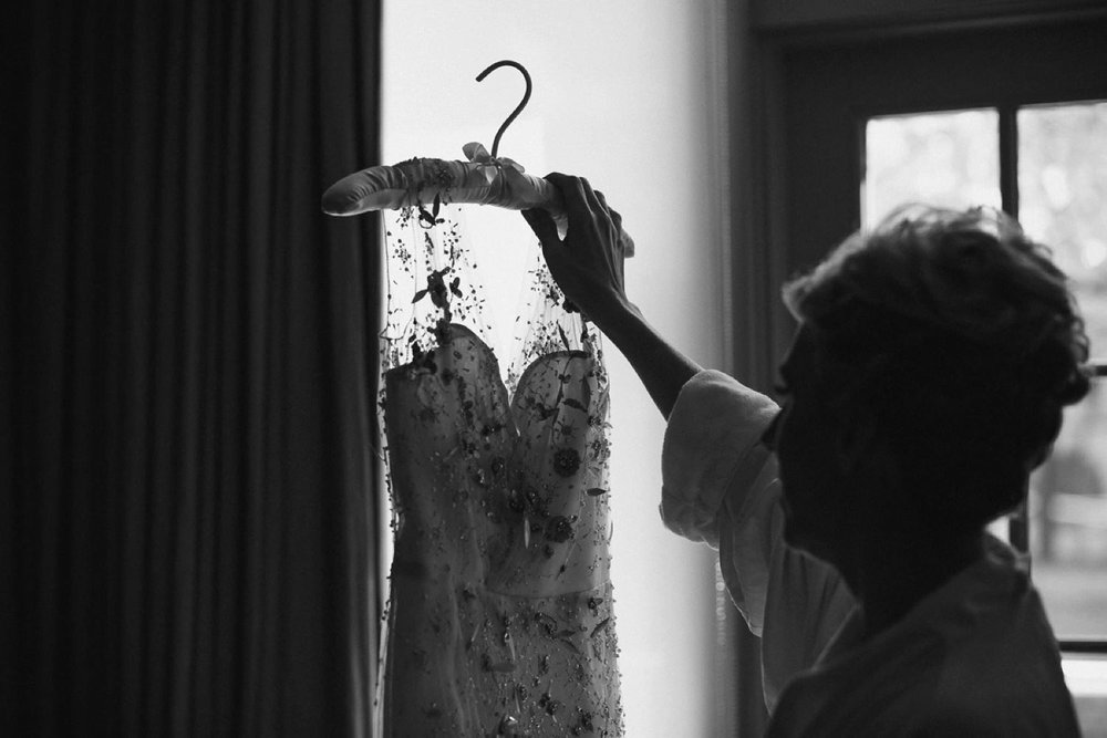 Bride looking at weding dress at The Ivy.