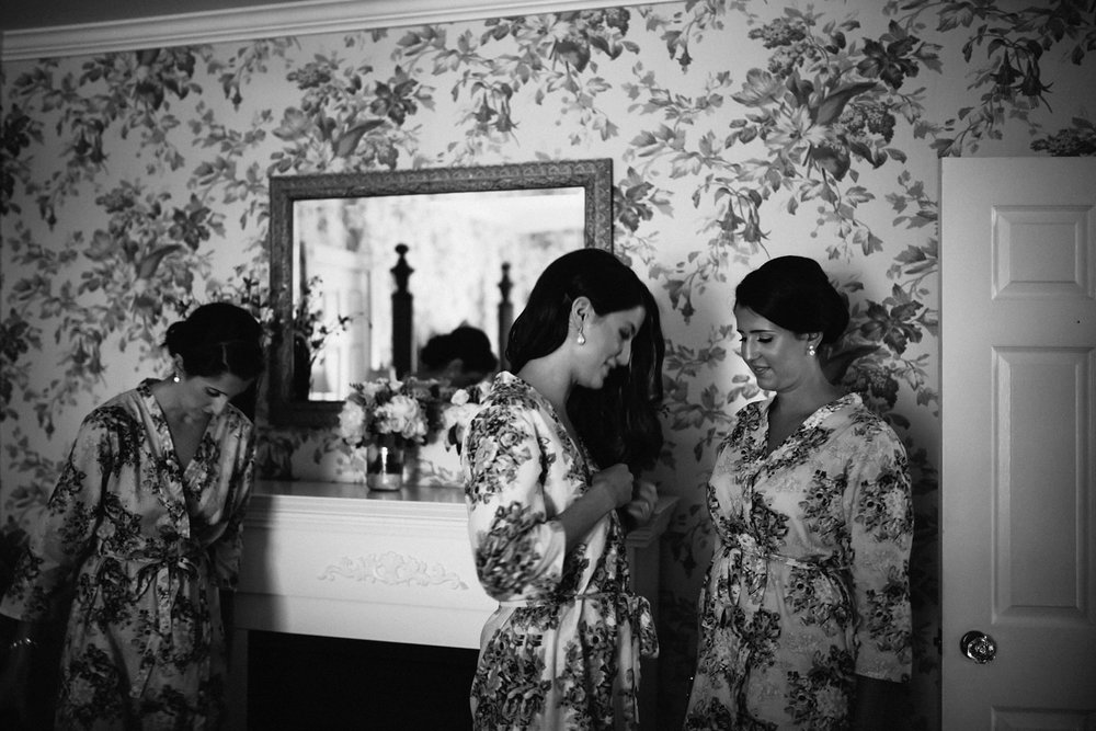 Bride and sisters getting ready for wedding at Kurtz Orchards.