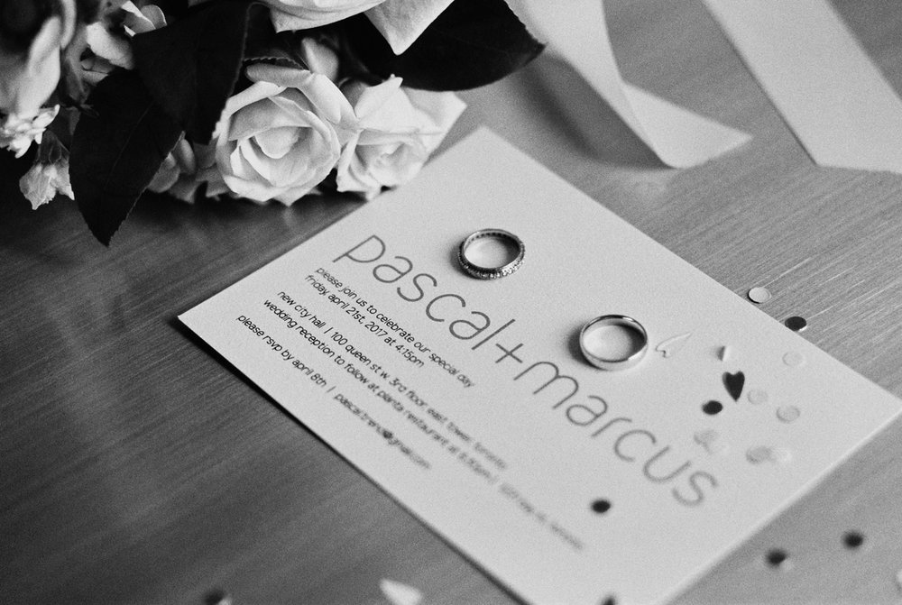 Wedding invitations and rings at Four Seasons Toronto.