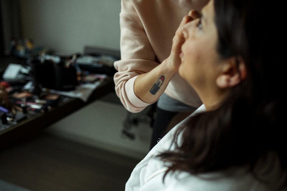 Putting make up on for bride in Toronto.