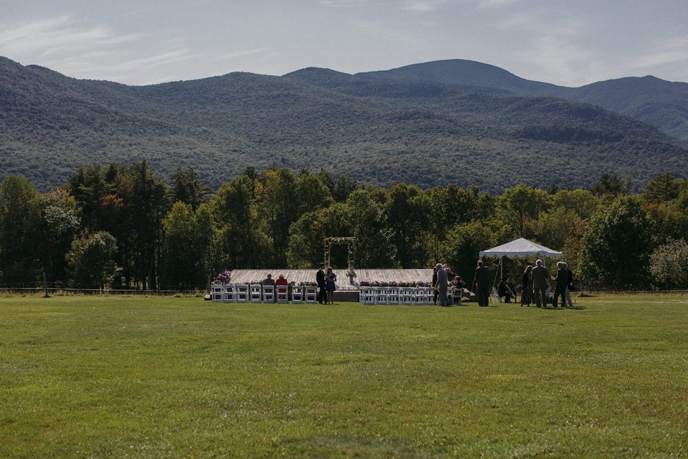 Ceremony in meadow and hills at Trapp Lodge Vermont.