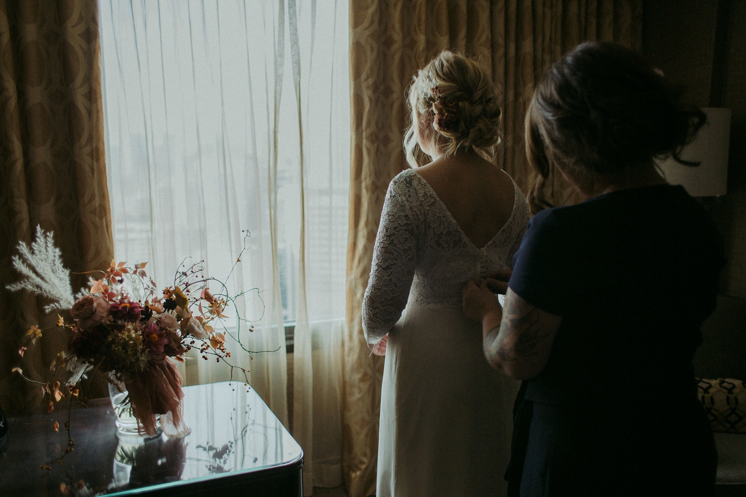 Bride getting dressed for Toronto elopement.