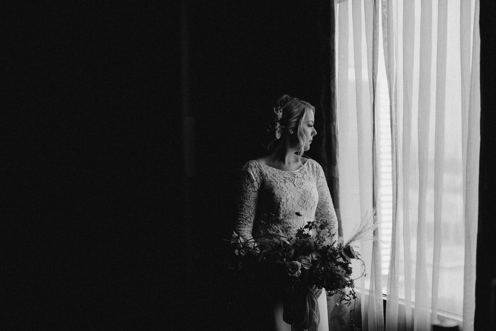 Bride looking at City Hall before wedding.