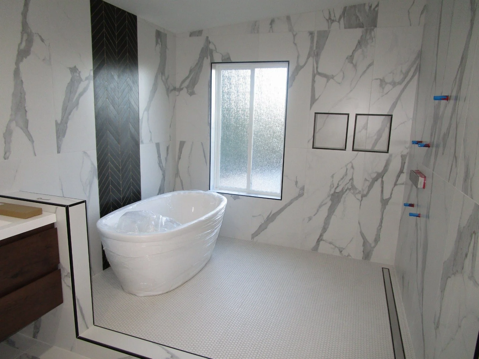 Master Bath waiting for fixtures and glass.