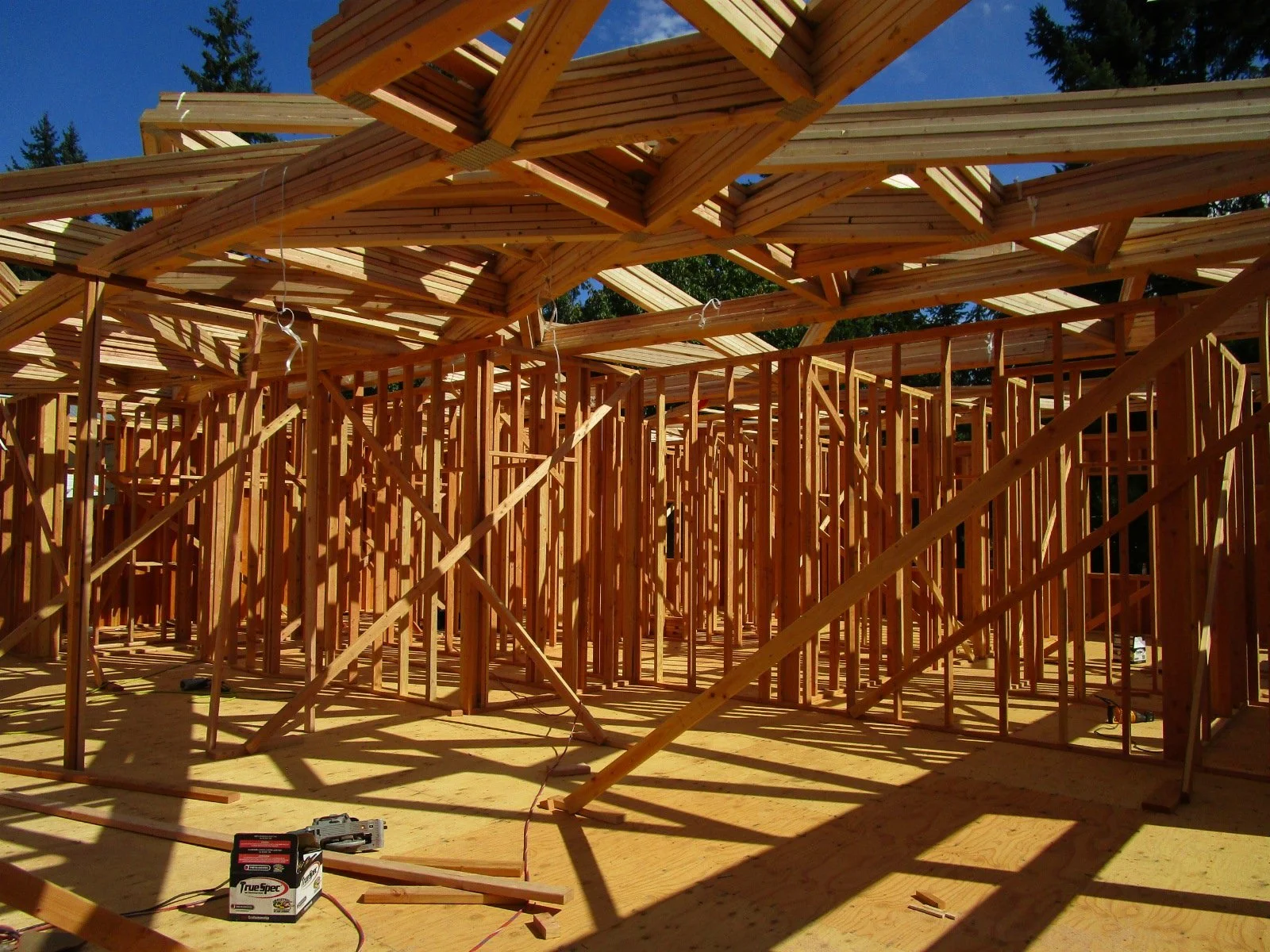 More roof trusses ready to roll up into place.