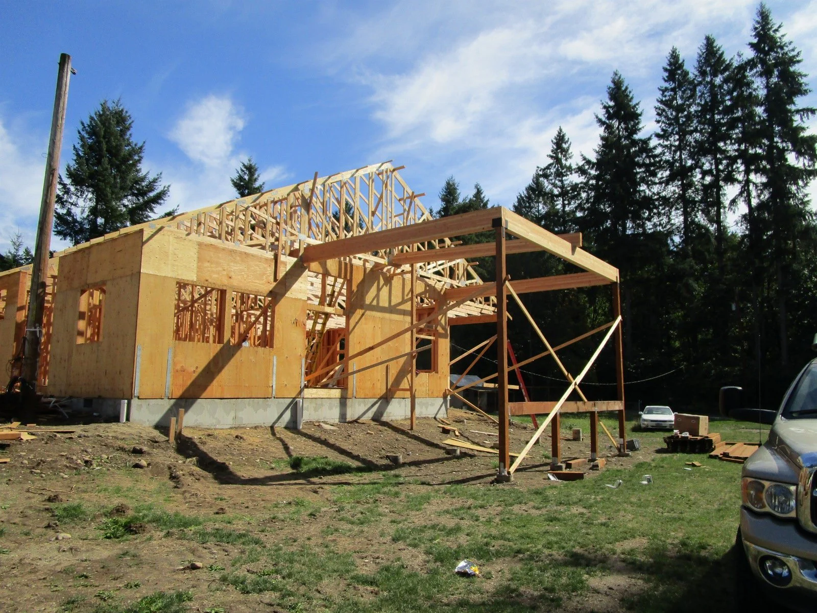 Glu-lam beams for outdoor covered are set in place.