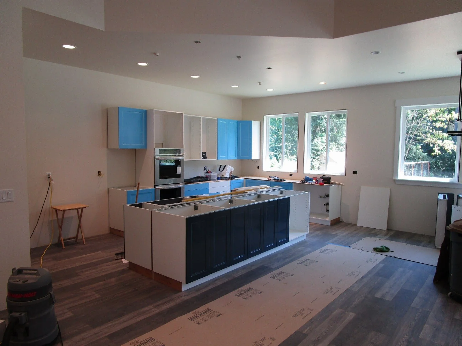 Kitchen cabinets going in.