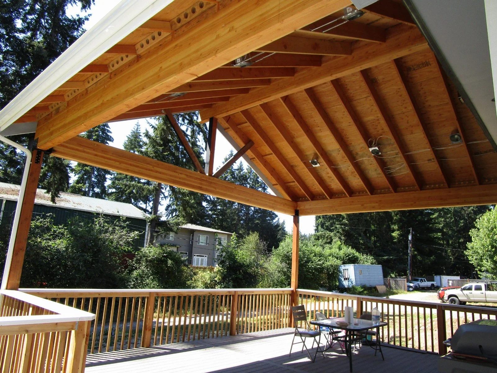 Outdoor cabana getting lights and heaters installed.