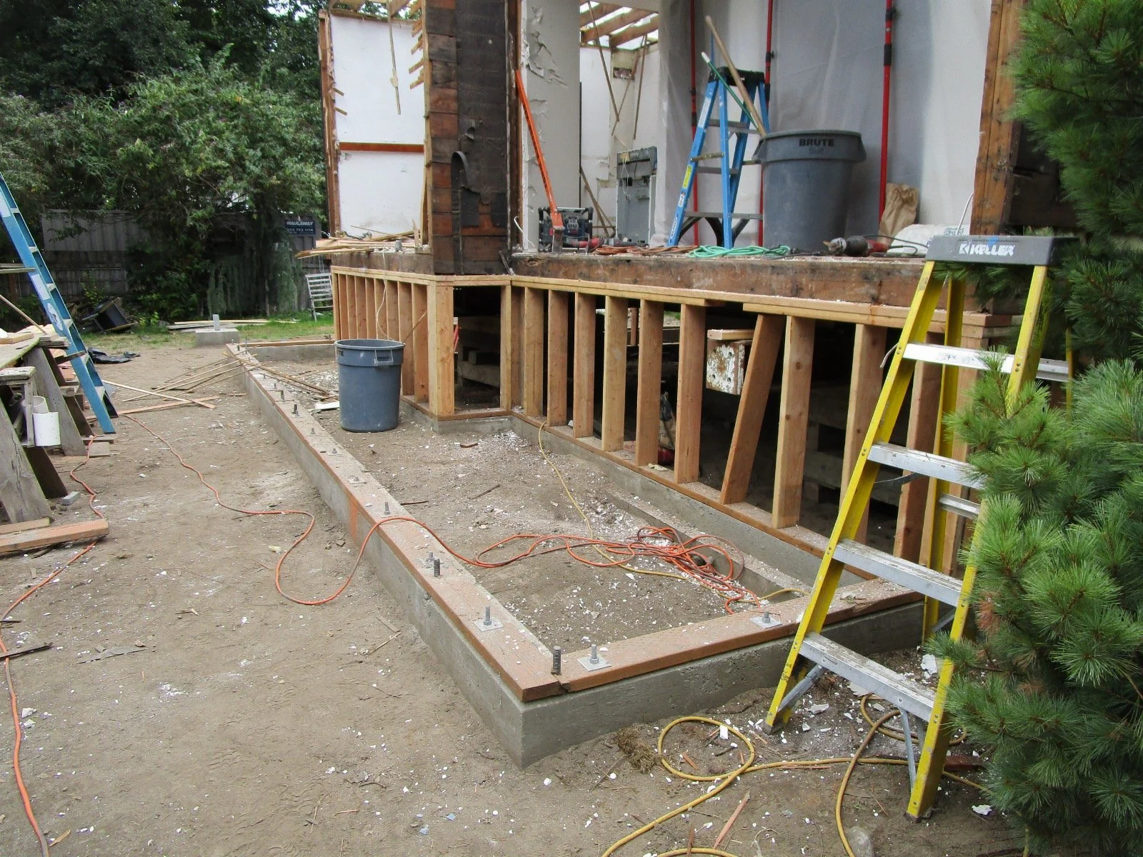 New pony walls to support the existing structure. New foundation for a portion of the addition.