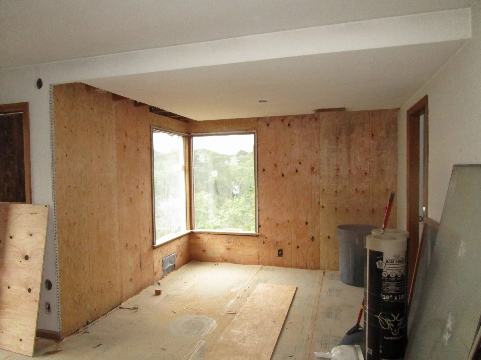 The new plywood going in to help with lateral strength.