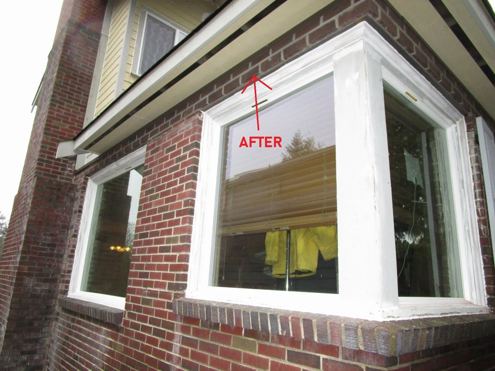 The original roof did not allow for brick over the windows. So brick was added.